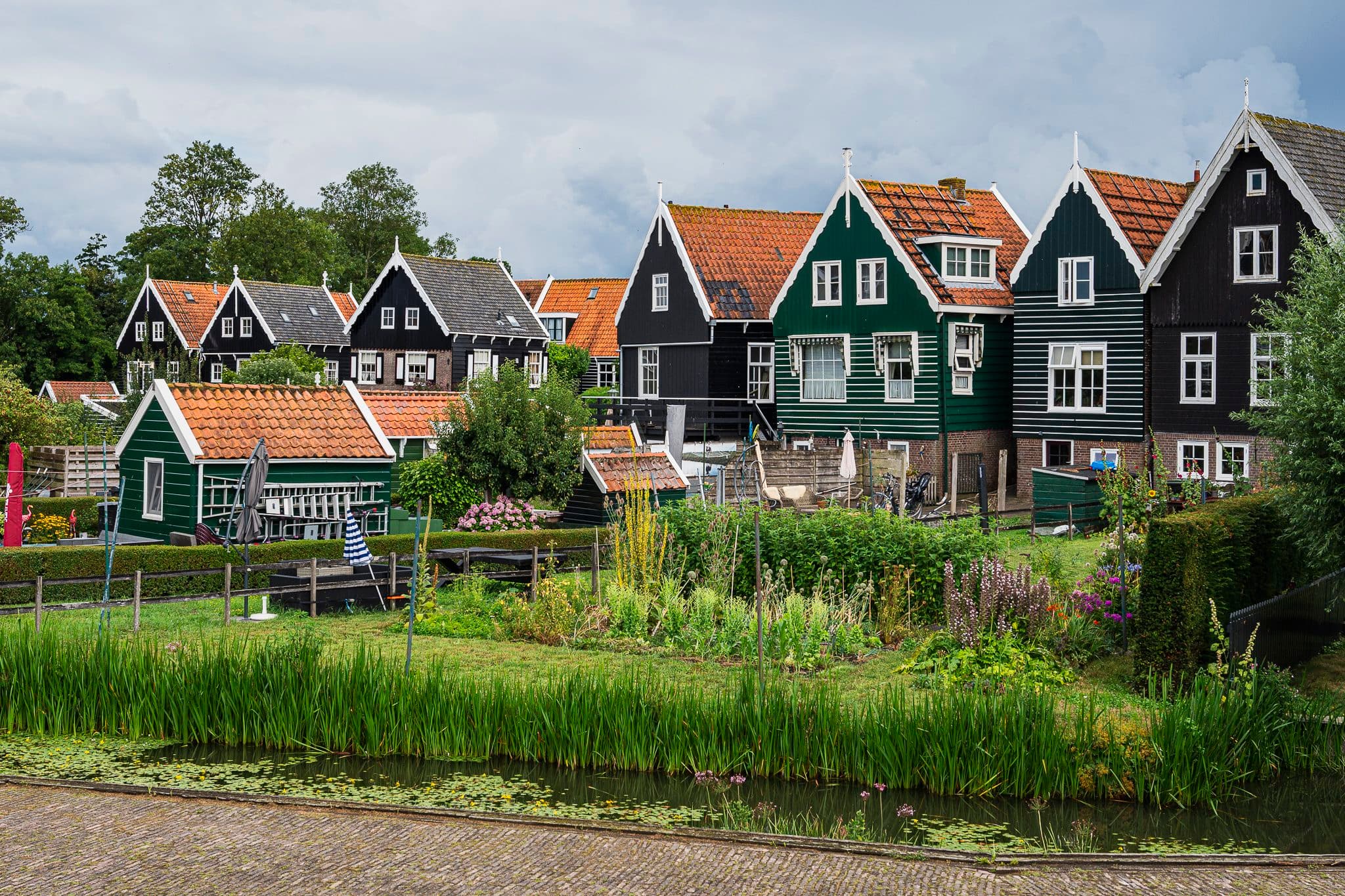 Green wooden houses of Marken by the water
